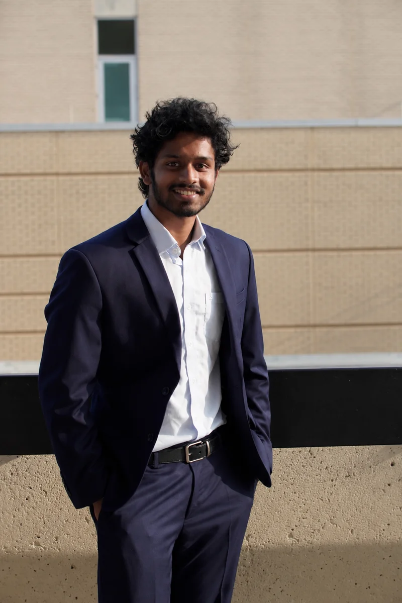 Charith Kapuluru, the real one, in a navy suit